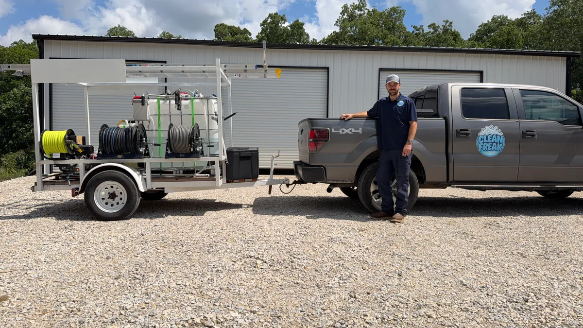 Cutler Polk, owner of Clean Freak, with the company truck and pressure washing trailer